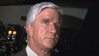 Leslie Nielsen as Dr. Rumack staring stonefaced in the cockpit in Airplane!